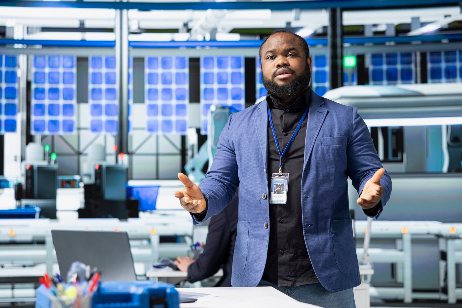 black director hosting a meeting to discuss renewable energy production